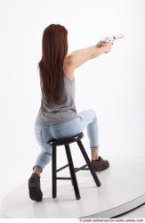 MOLLY SITTING POSE WITH GUN